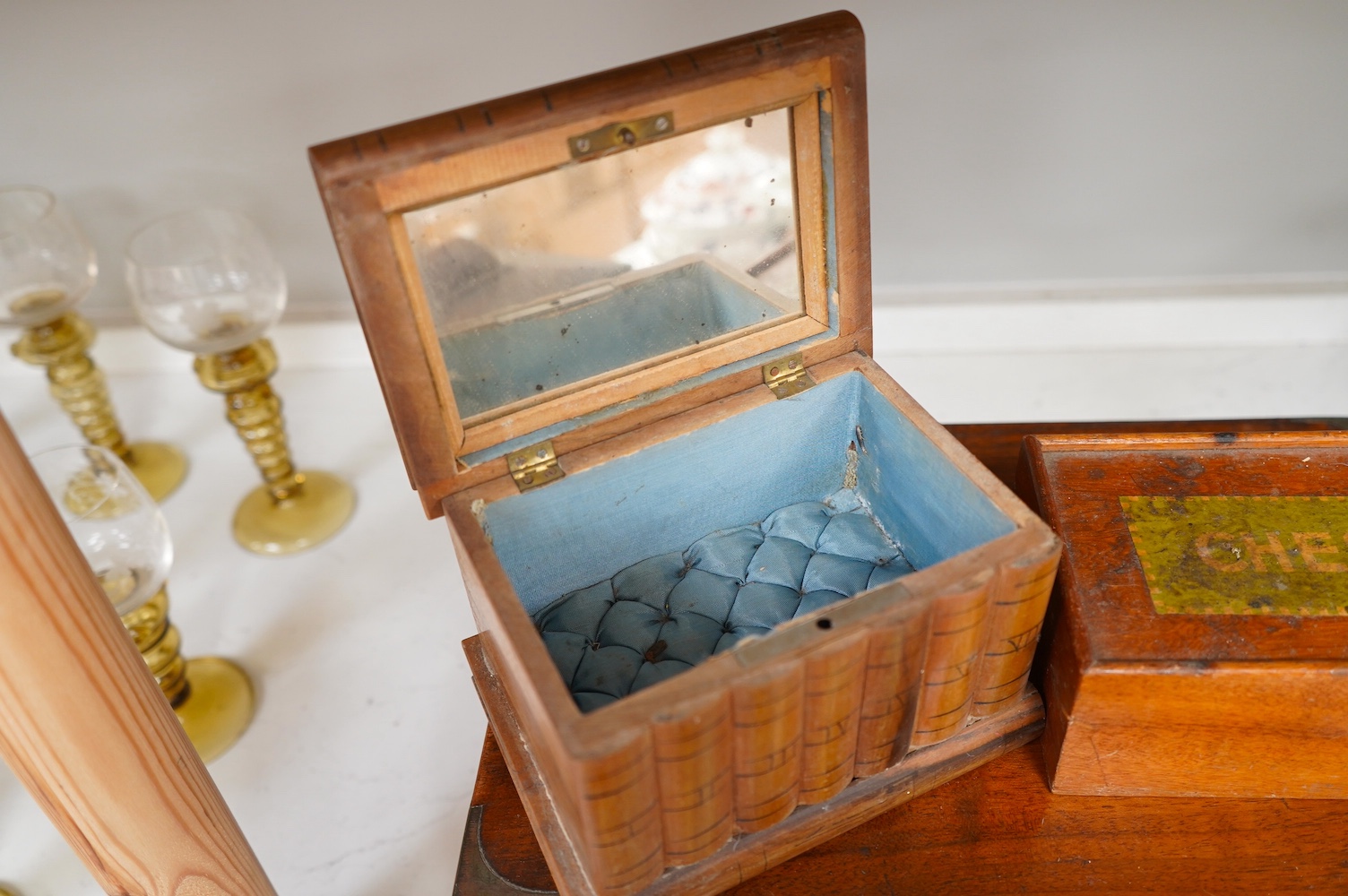 Six 19th century and later boxes to include a writing box, tea caddy, quill box and a jewellery box in the form of books with mirrored interior, largest 35cm wide. Condition - varies